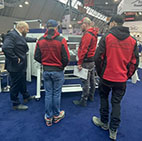 Many_companies_came_to_Dach_und_Holz_with_several_colleagues._These_building_fitters_were_shown_the_ASK_3,_a_manual_folding_machine_with_segmented_tools_on_all_beams.